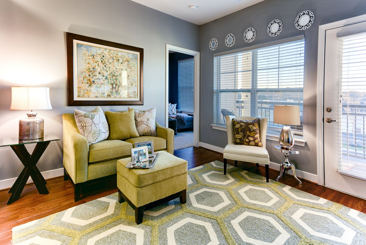 Open-concept living room with modern furnishings at Paragon at Columbia Overlook Apartments, ideal for comfort and style