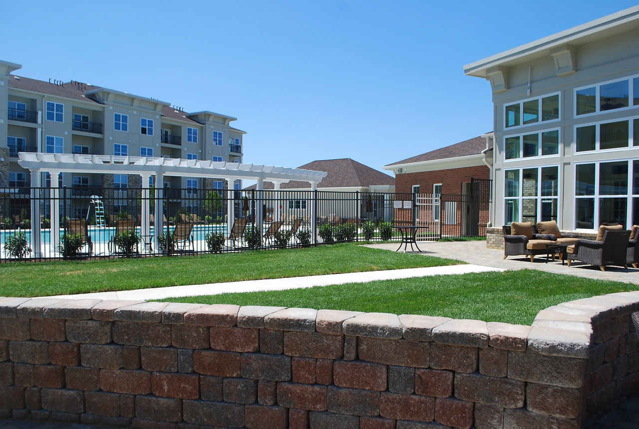 Elegant outdoor patio with stylish seating and greenery at Paragon at Columbia Overlook Apartments, perfect for relaxation and social gatherings