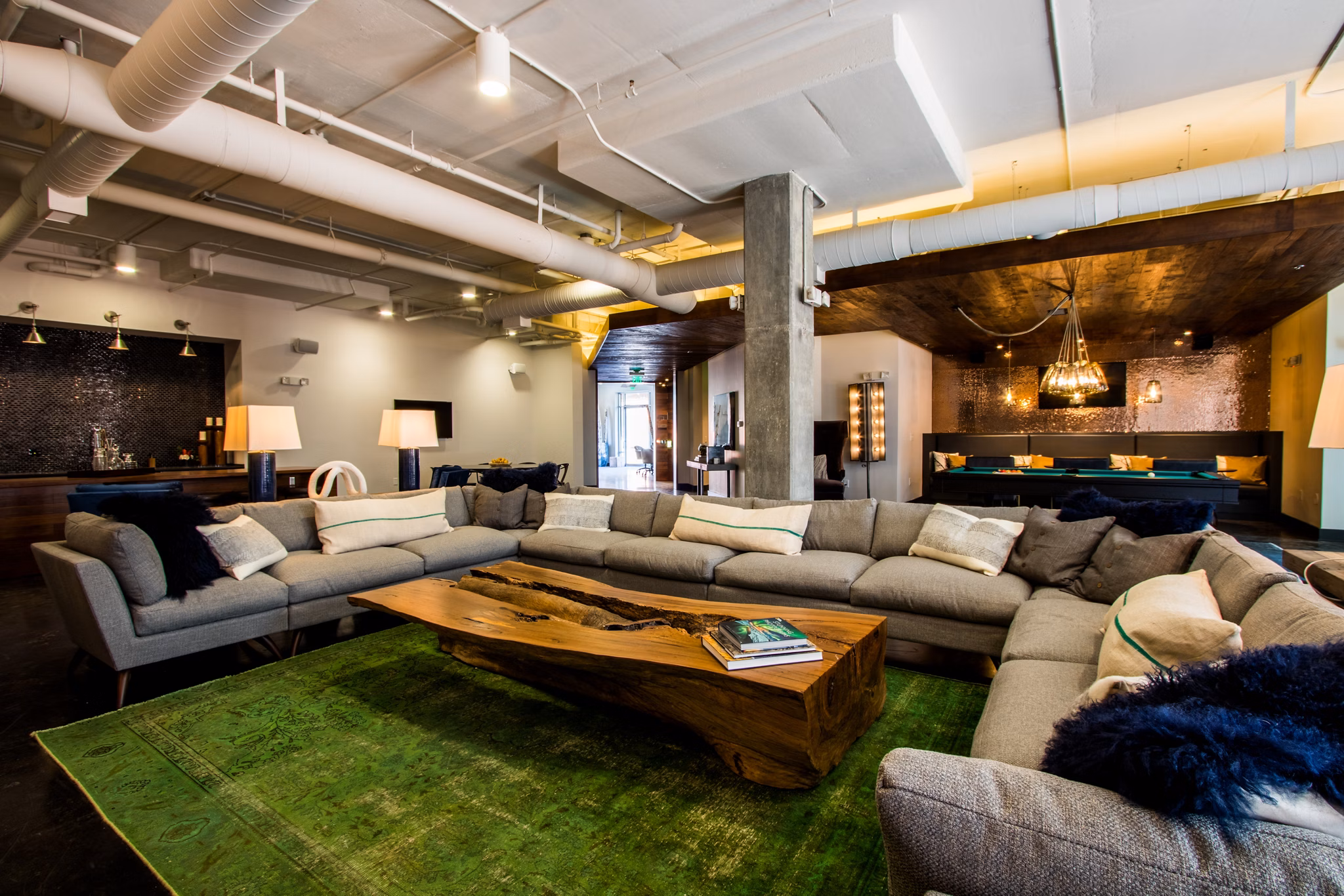 Luxury clubhouse with contemporary design at Ellison on Broad Apartments, featuring a spacious lounge and modern amenities for residents
