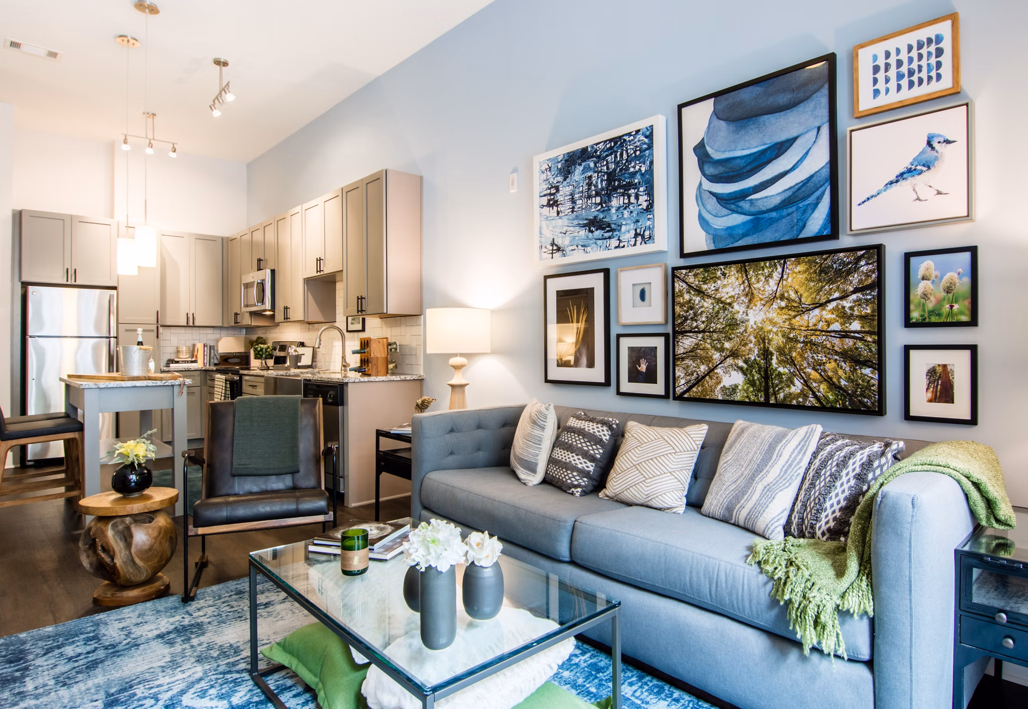 Cozy living room with modern decor and large windows in Ellison on Broad Apartments, offering a luxurious experience in downtown