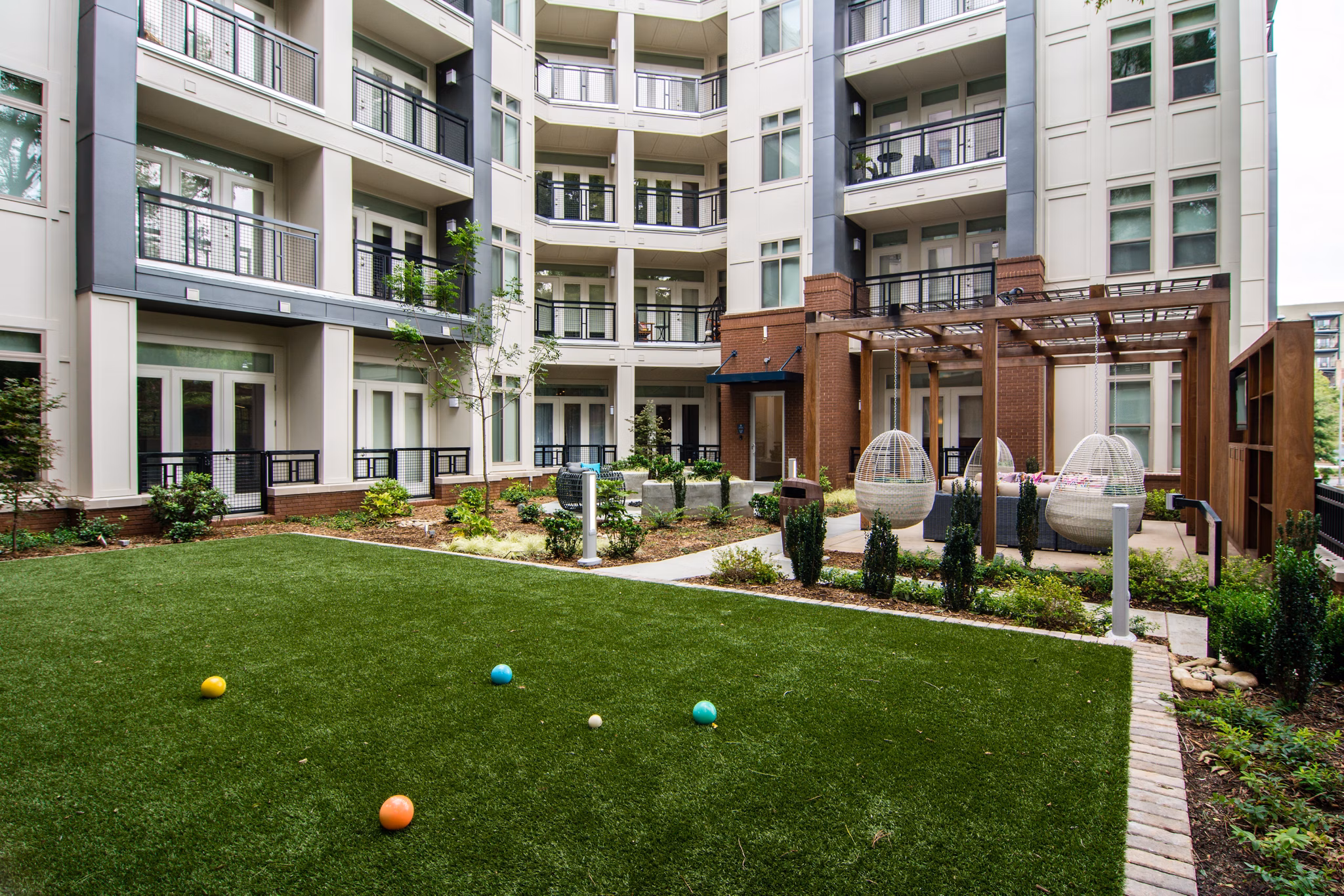 Courtyard at Ellison on Broad Apartments featuring lush landscaping and seating areas for relaxation
