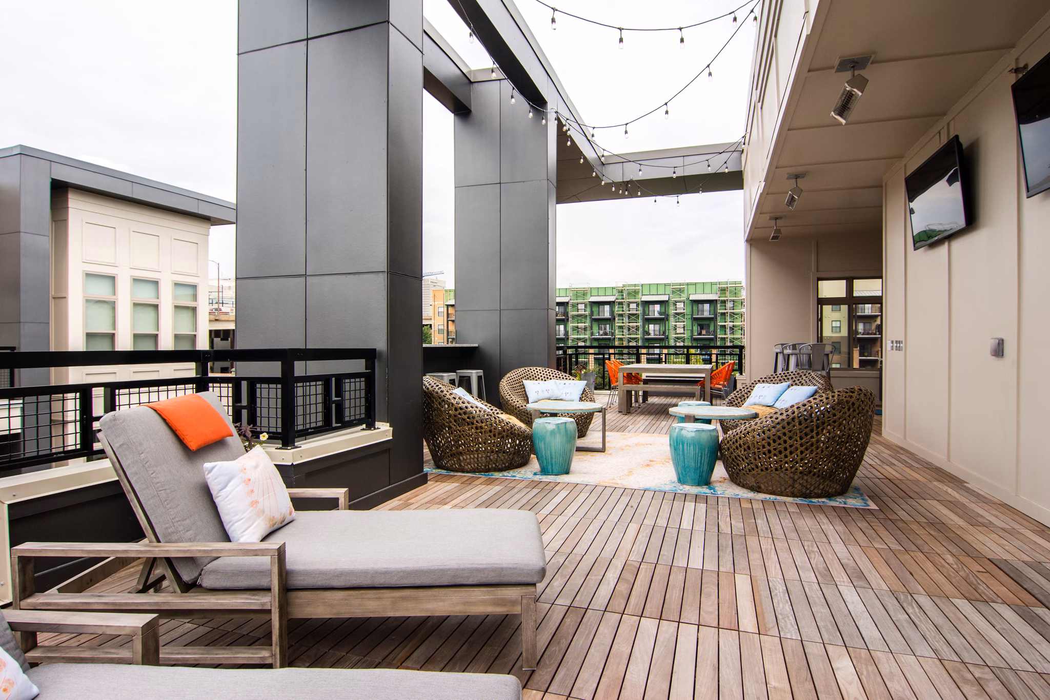 Outdoor patio with cozy seating at Ellison on Broad luxury apartments, ideal for relaxation and socializing in a vibrant community setting