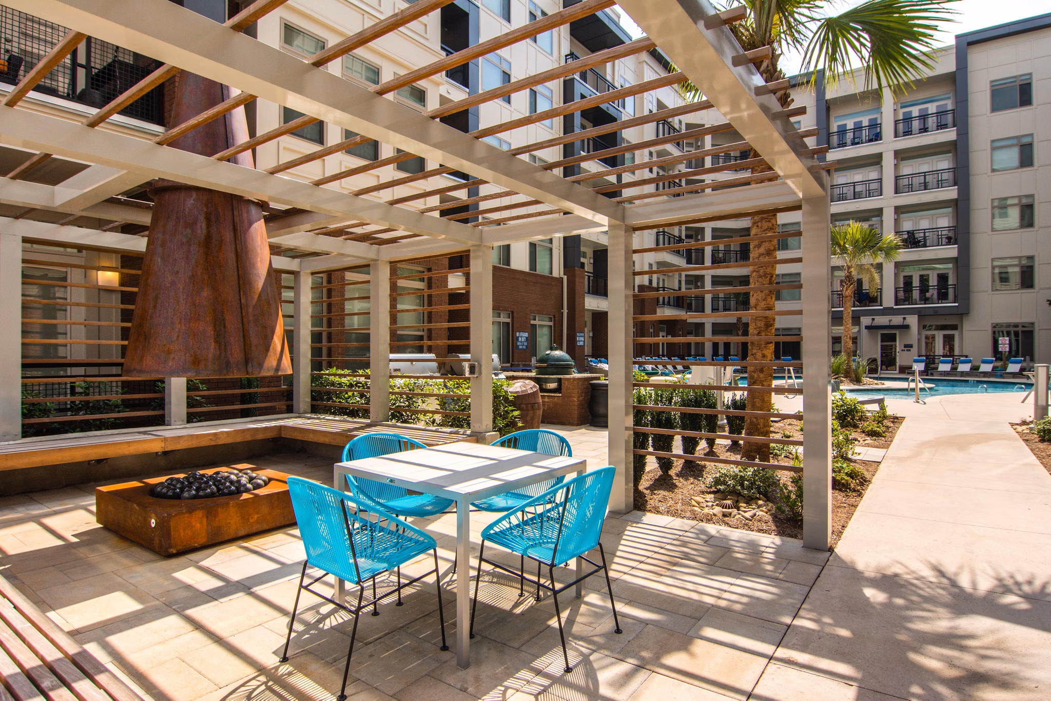 Cozy outdoor patio with modern furniture at Ellison on Broad Apartments