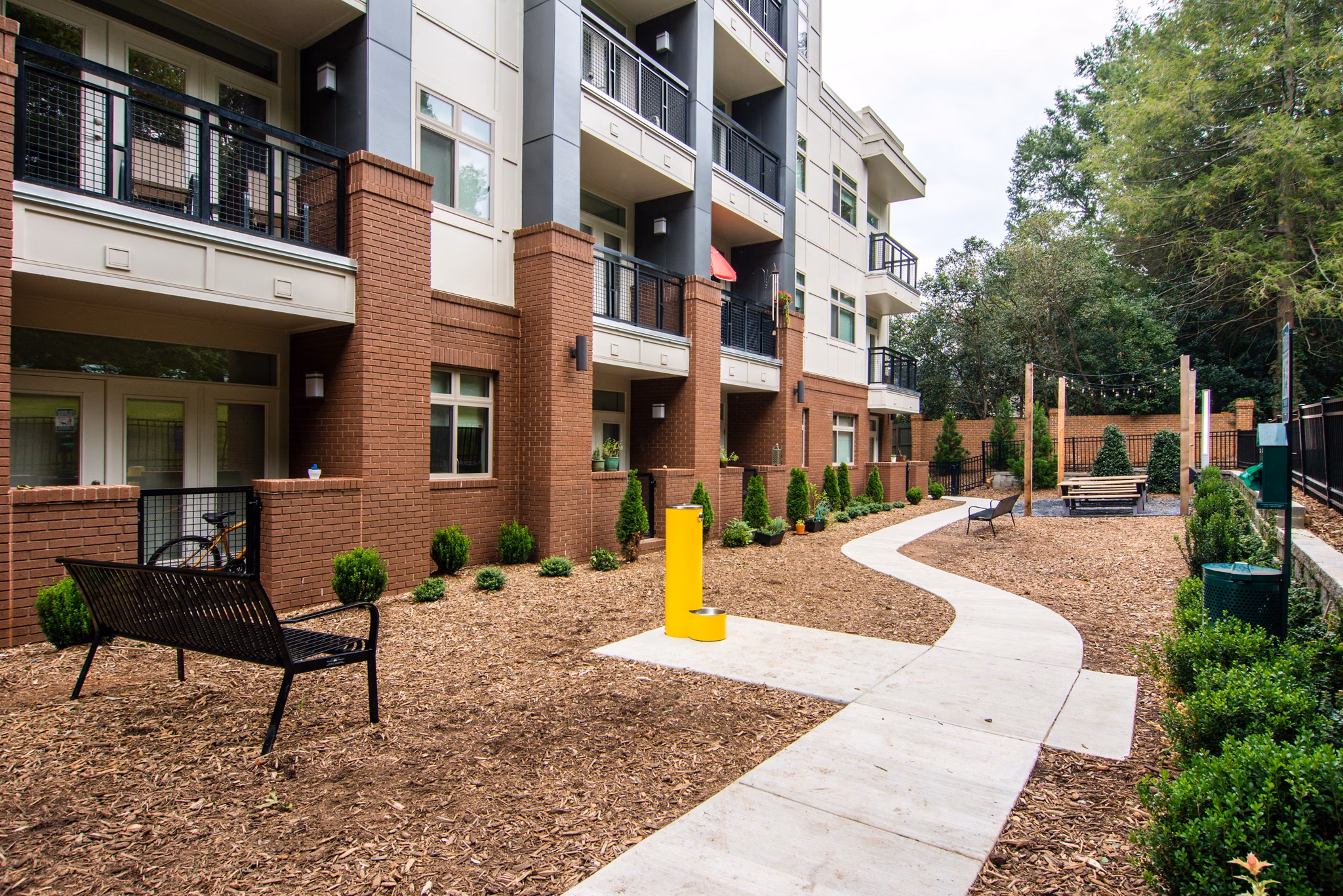 Leash-free dog park featuring agility equipment at Ellison on Broad Apartments