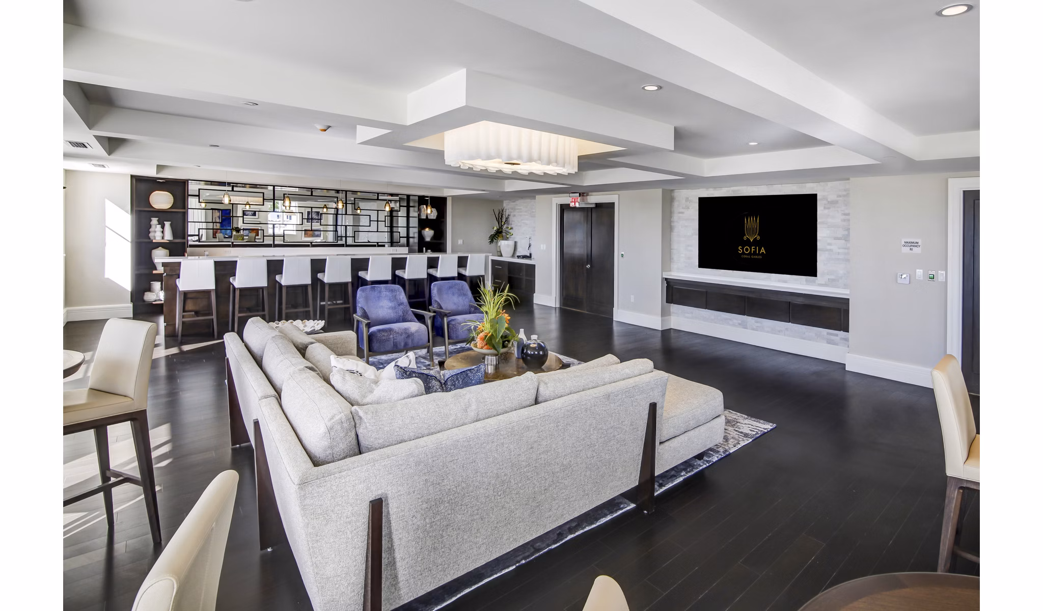 Sofia Coral Gables: Stylish clubhouse with modern furnishings and outdoor patio at luxury apartments in Coral Gables