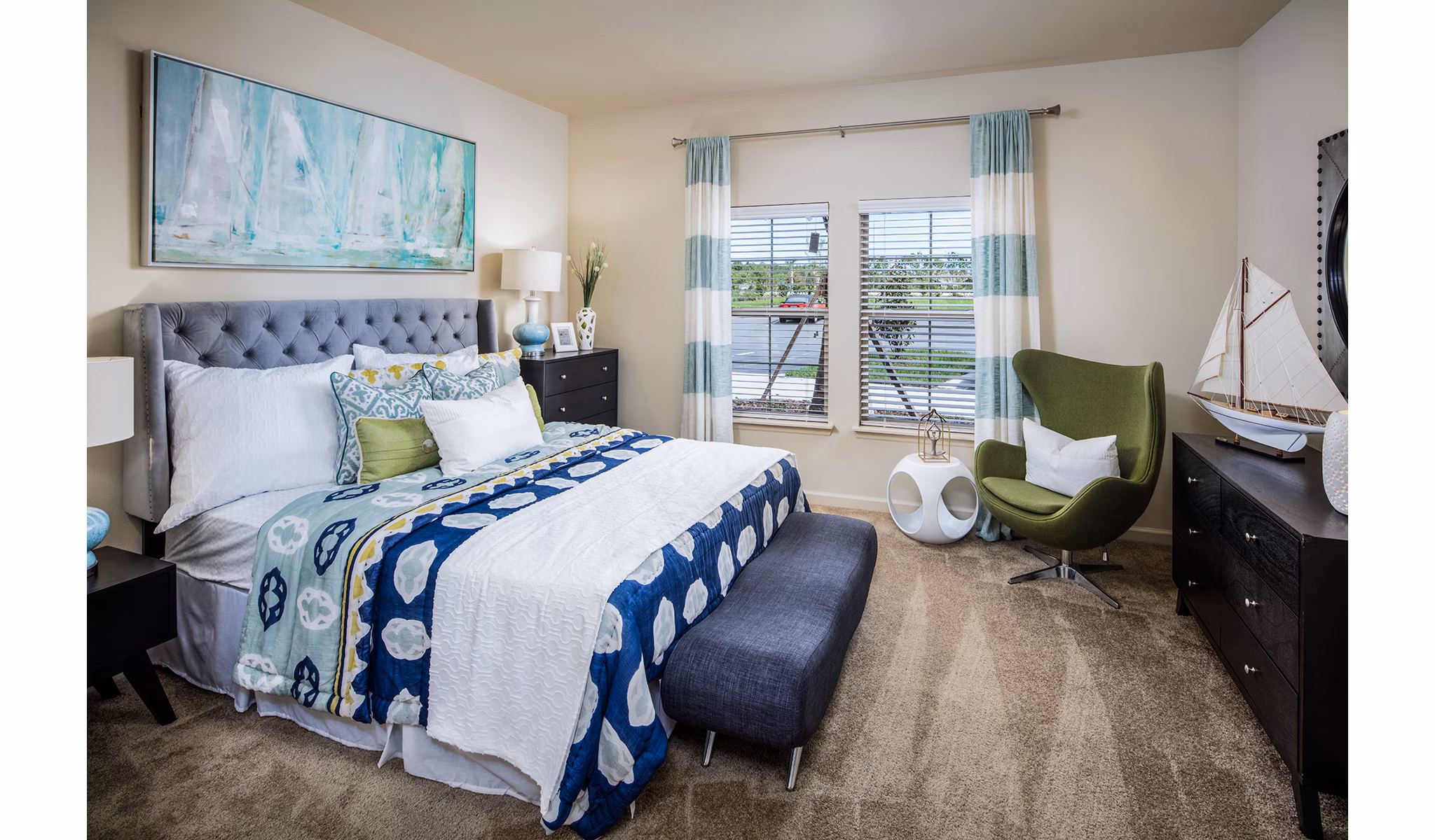 Cozy bedroom with contemporary furnishings at Sanctuary at West Port Apartments