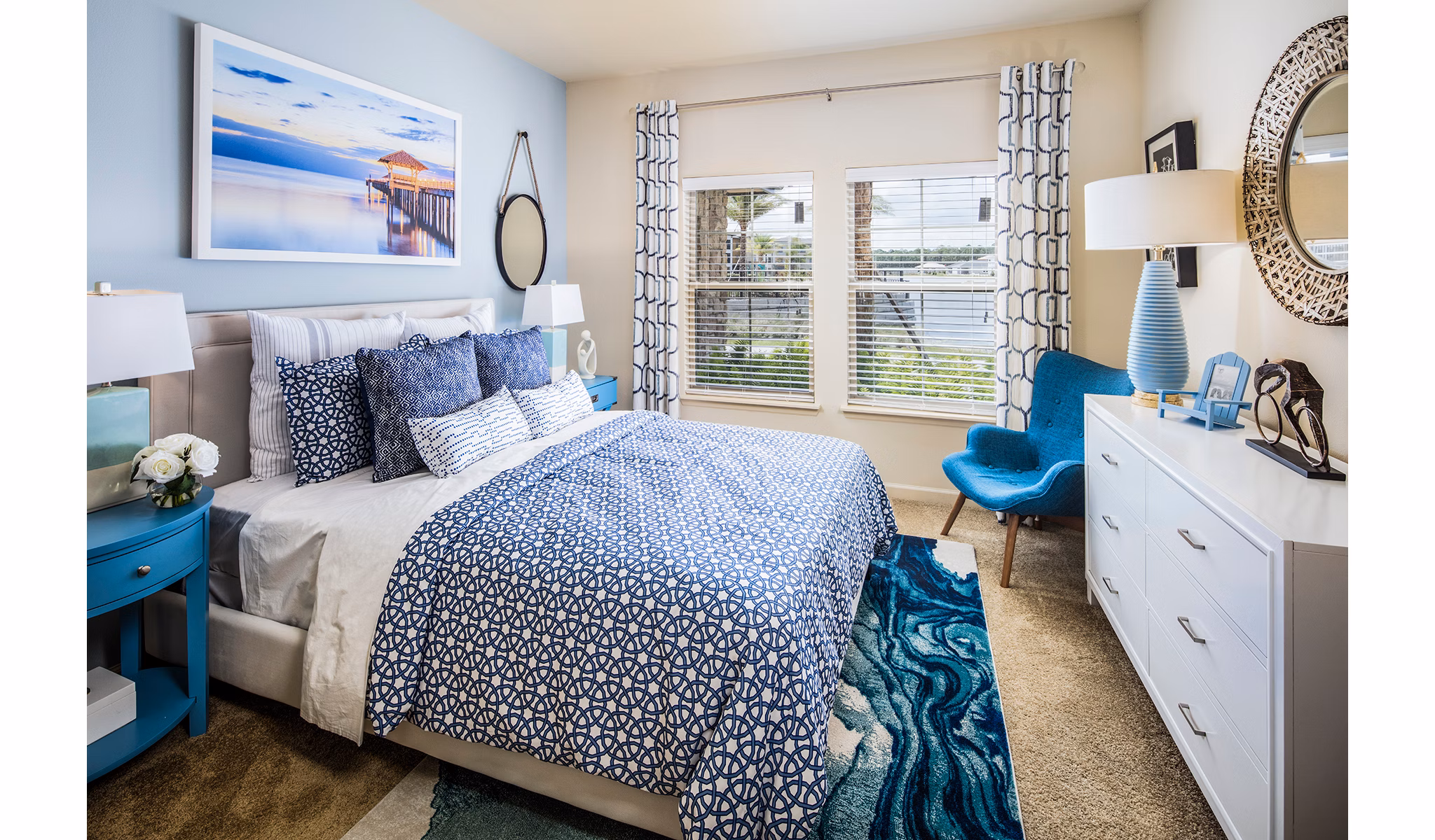 Cozy bedroom with contemporary decor at Sanctuary at West Port Apartments, offering luxury living in Port St Lucie