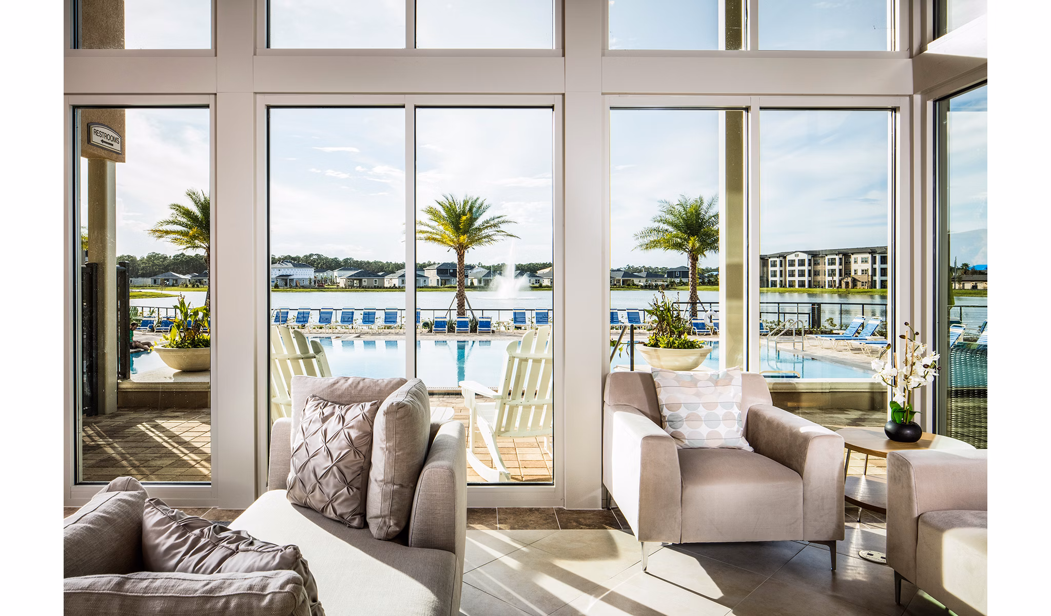 Modern clubhouse with spacious seating and billiards table at Sanctuary at West Port Apartments