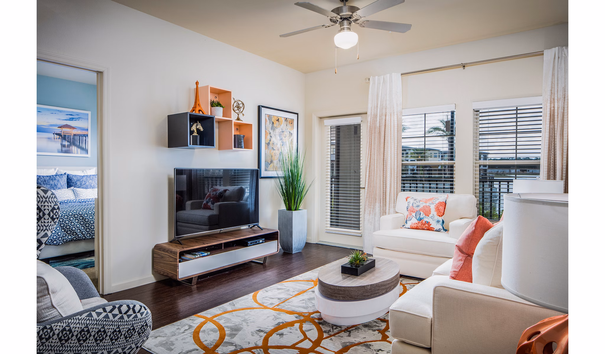 Spacious living room with modern furnishings in Sanctuary at West Port Apartments