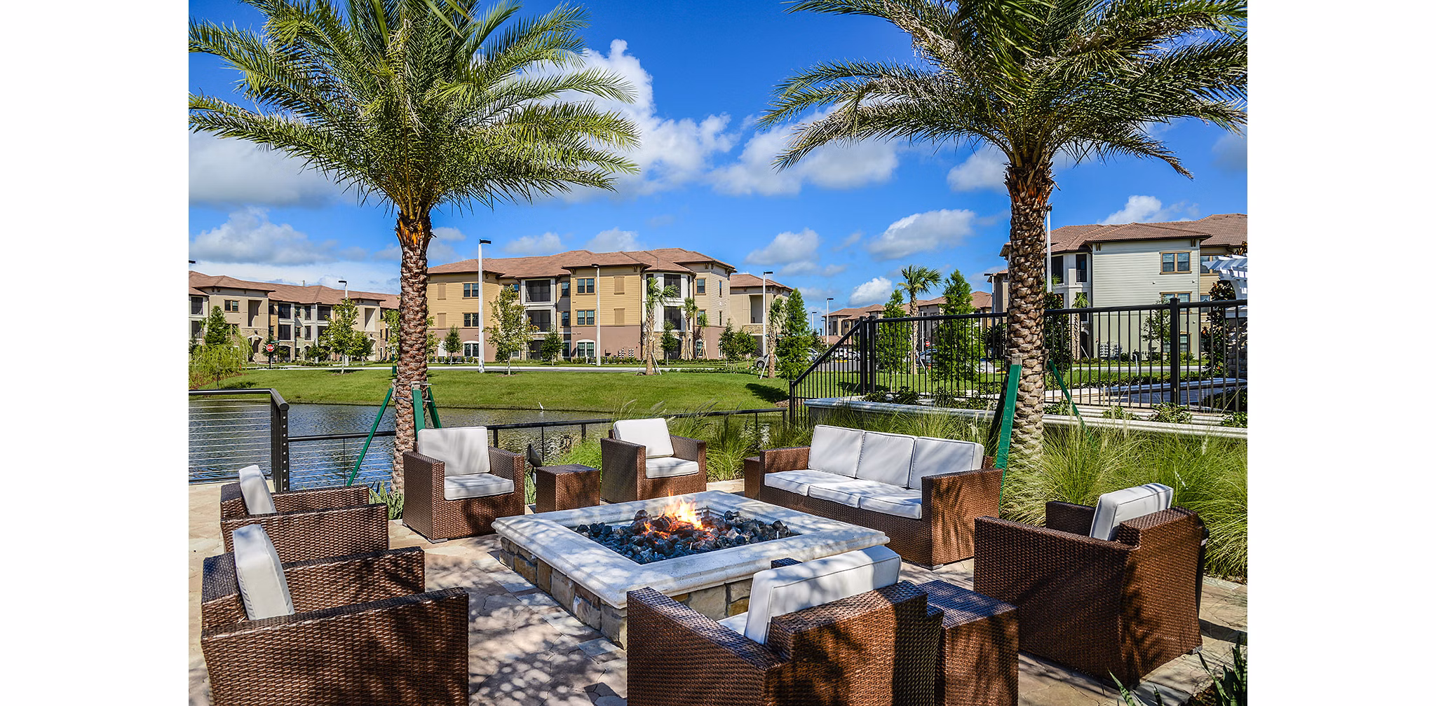Fire pit at Sanctuary at West Port Apartments: outdoor seating area with modern design ideal for social gatherings and relaxation