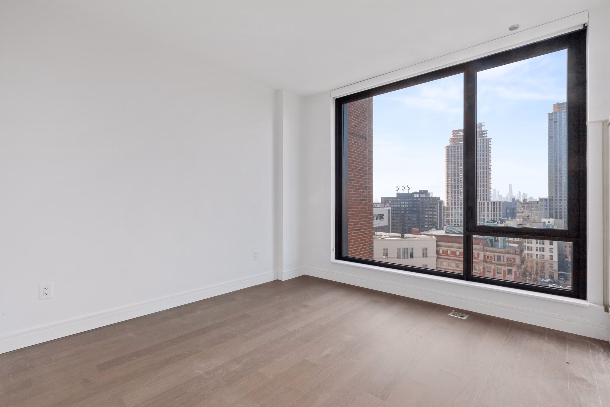 Bedroom at Watermark LIC featuring luxury design and city views, part of Greystar's premier apartments in Long Island City