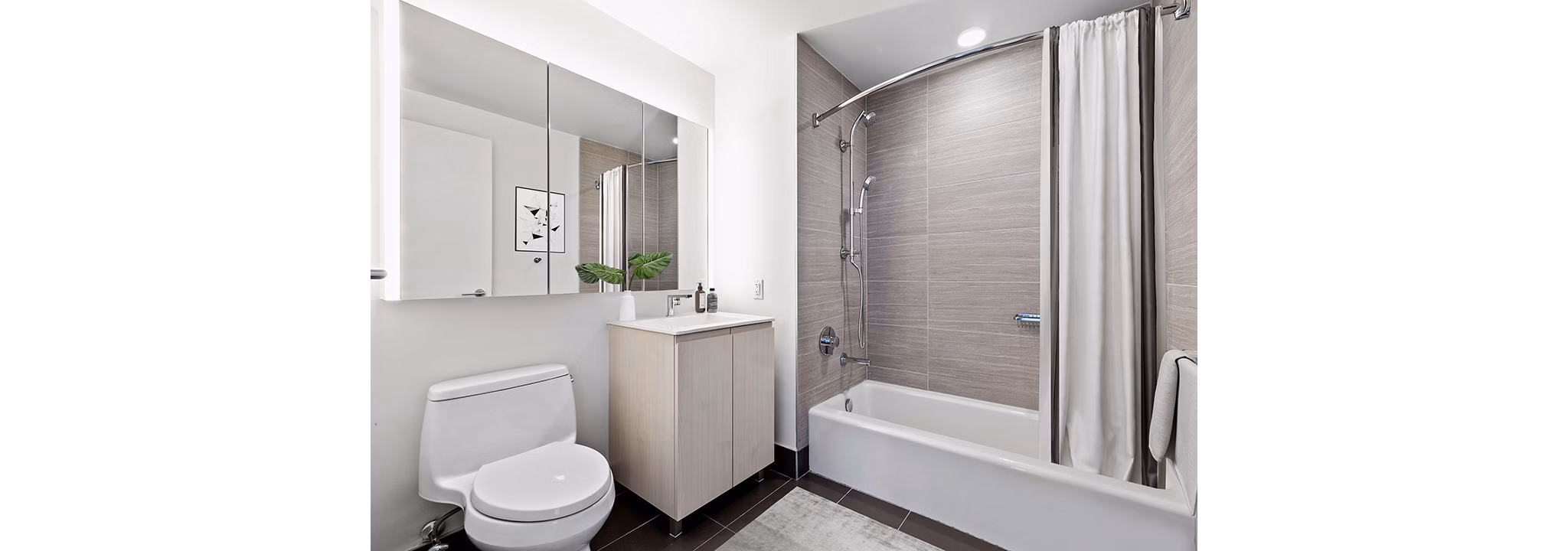 Modern bathroom with sleek fixtures at Watermark LIC apartments