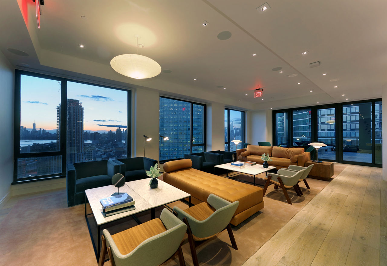 Clubhouse featuring modern design and seating areas at Watermark LIC luxury apartments