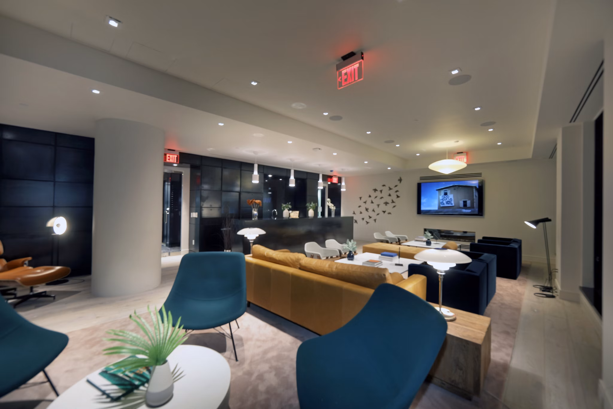 Clubhouse at Watermark LIC: Spacious clubhouse with modern decor and ample seating for gatherings in luxury apartment community