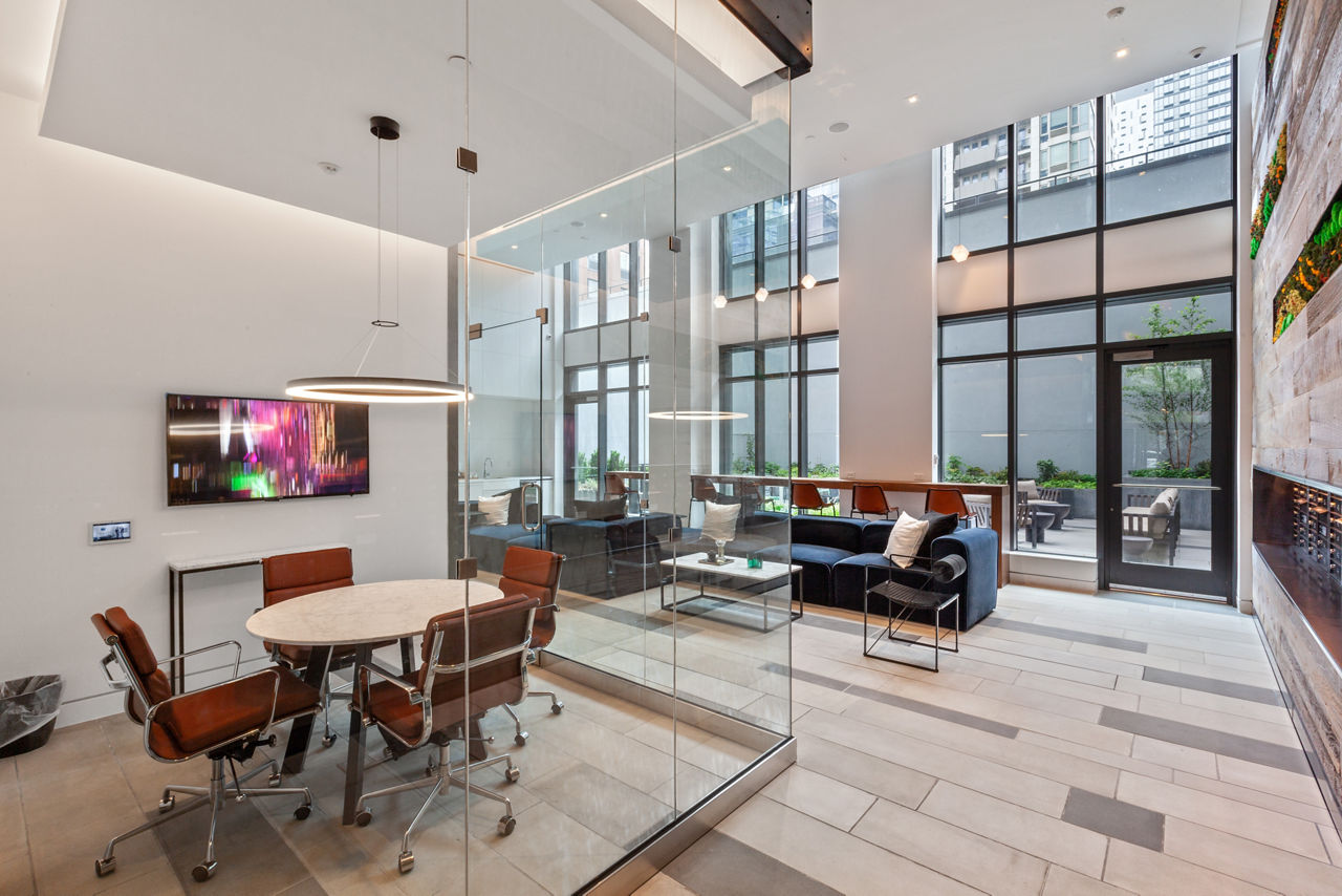 Clubhouse featuring modern design and social seating at Watermark LIC apartments