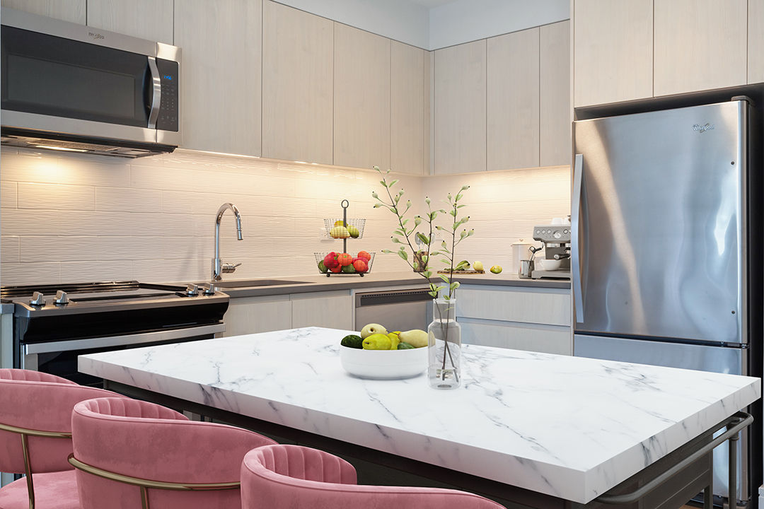 Modern kitchen with stainless steel appliances at Watermark LIC luxury apartments