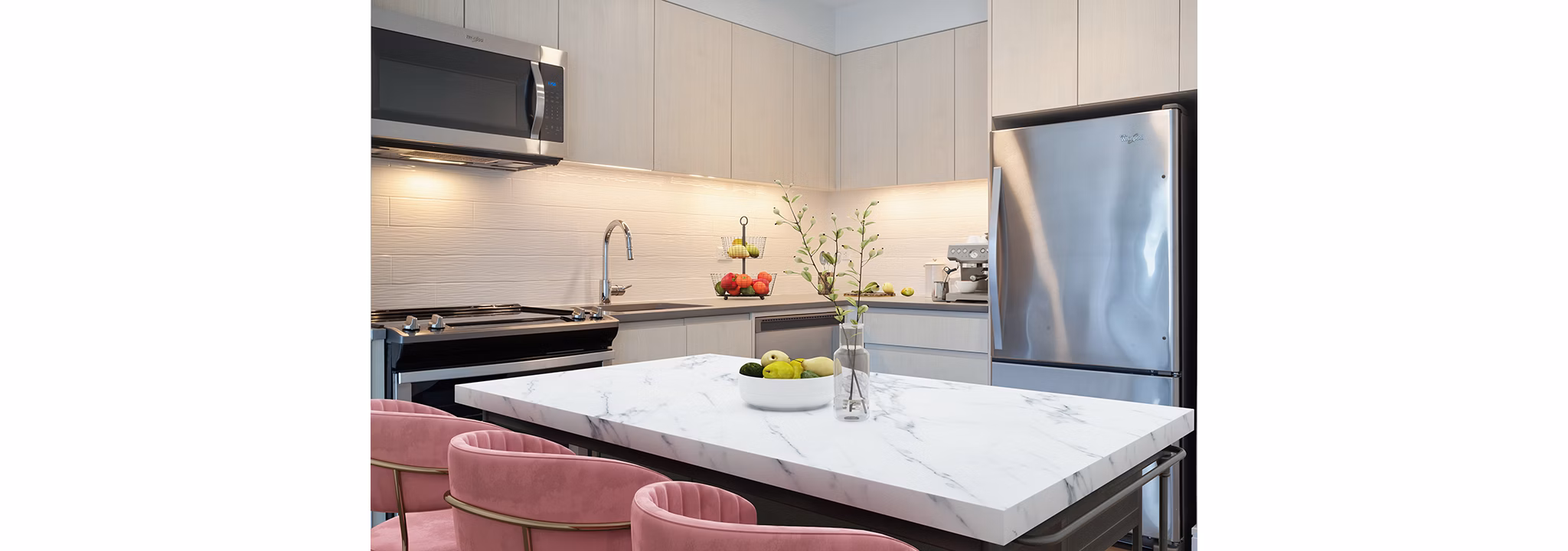 Modern kitchen with stainless steel appliances at Watermark LIC luxury apartments