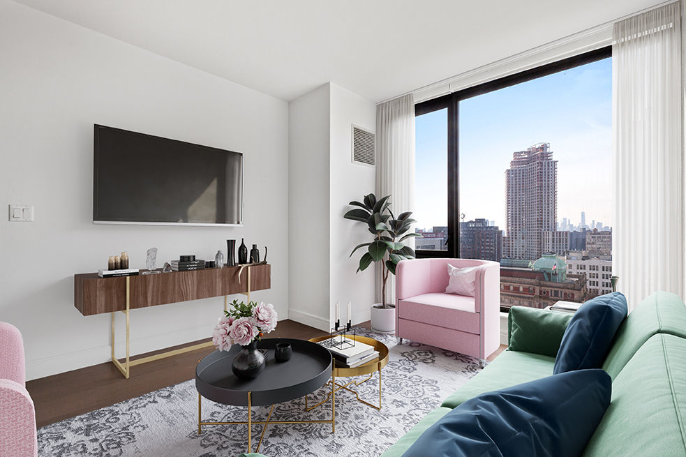 Spacious living room with modern decor and natural lighting in Watermark LIC apartments