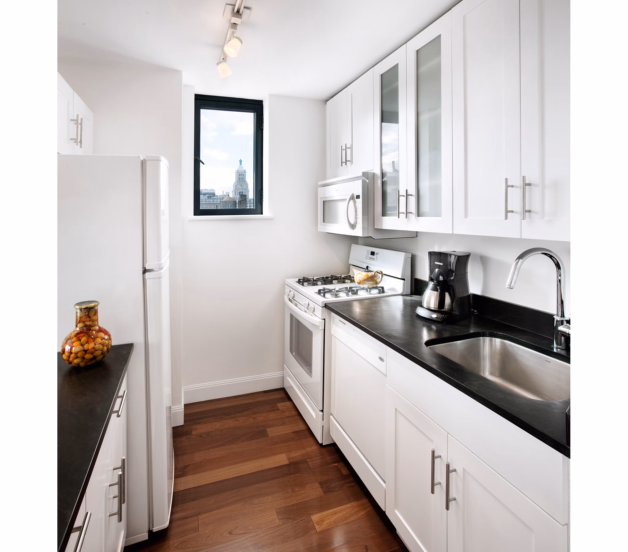 Modern kitchen with stainless steel appliances in INSTRATA Gramercy Apartments, luxury living in New York City