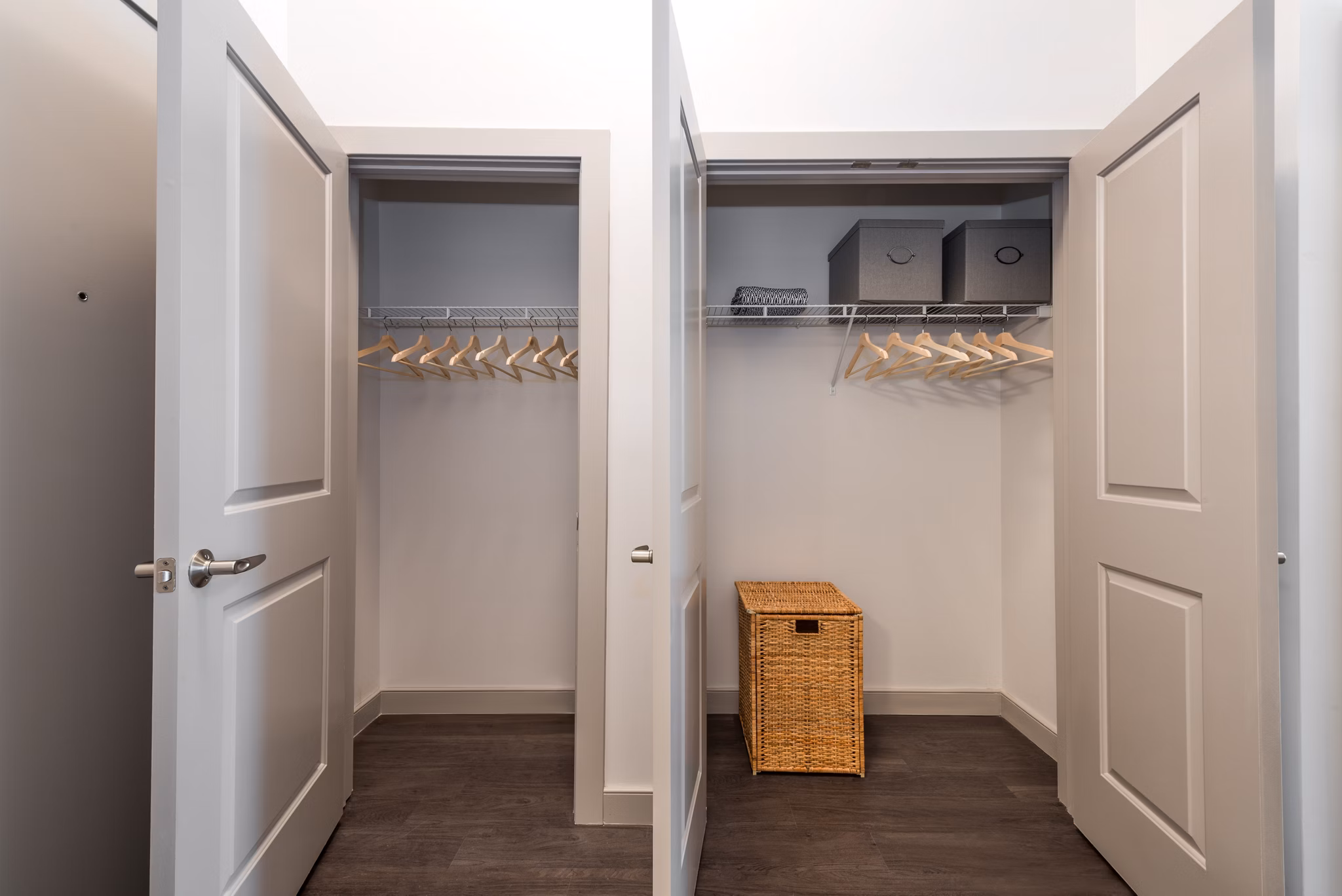 Spacious walk-in closet featuring organized hangers and storage solutions in luxury apartments