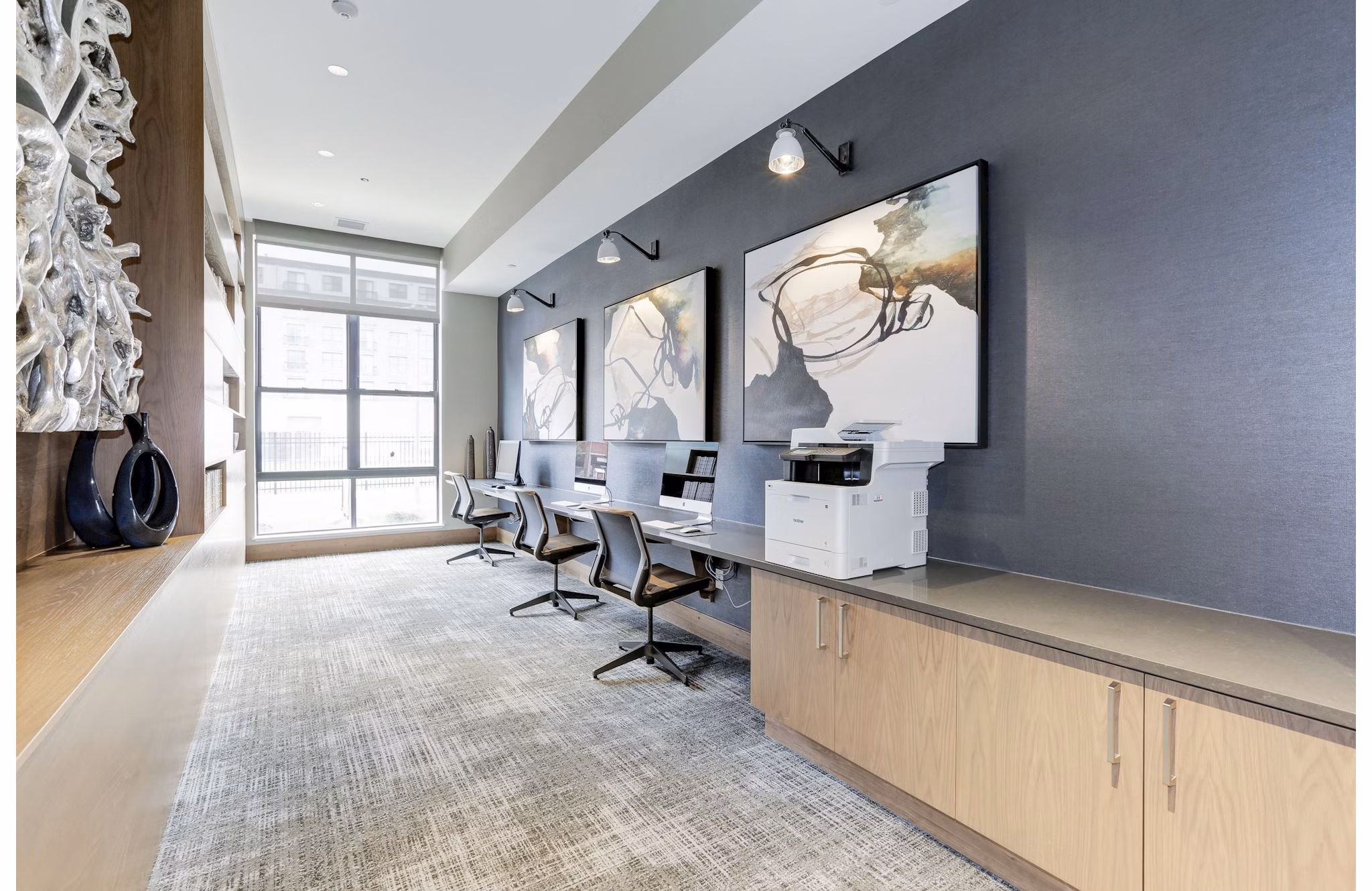 Modern business center with workstations at Porter Street Apartments enhancing productivity for residents