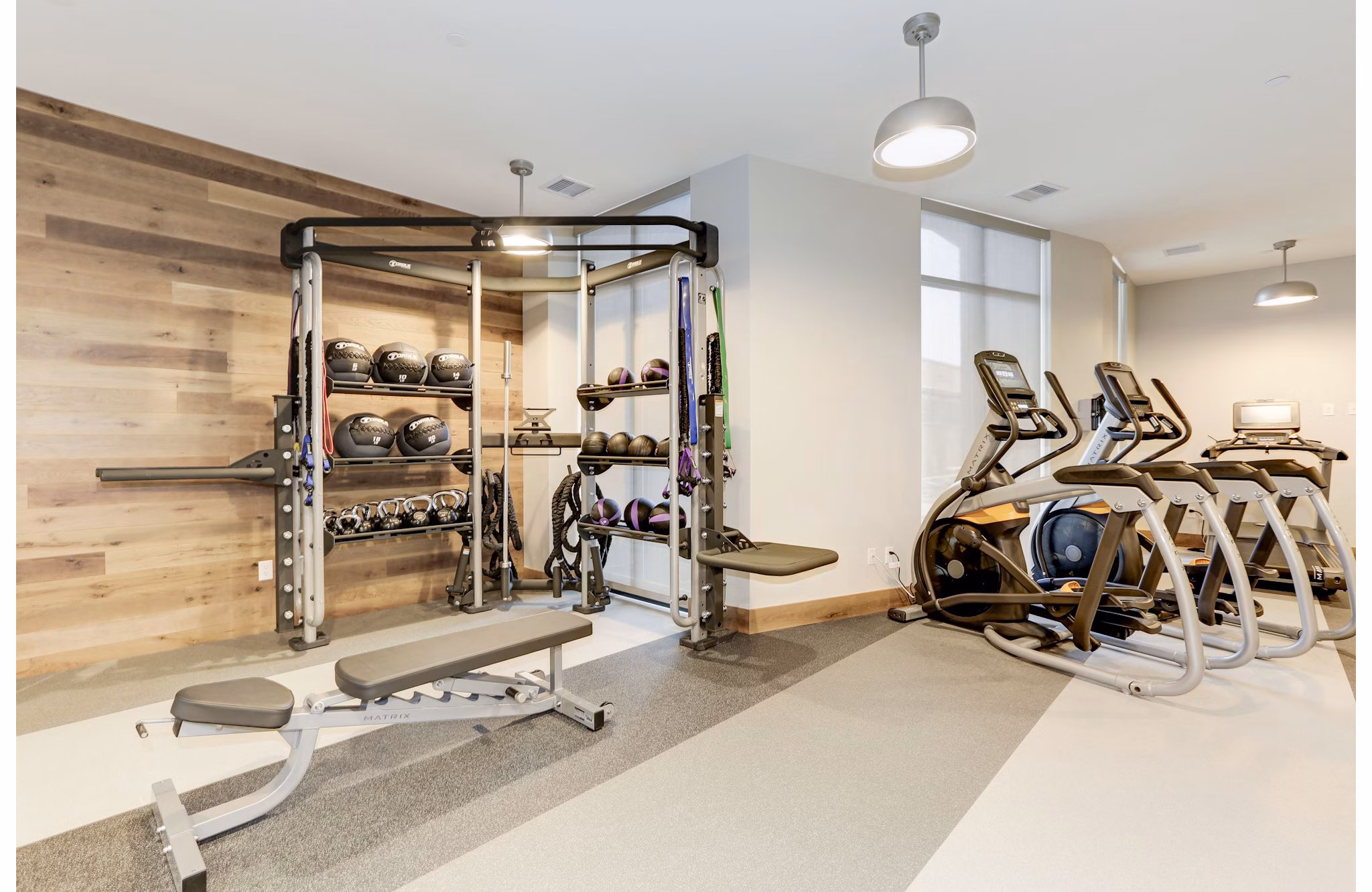 Fitness center with modern equipment at Porter Street Apartments