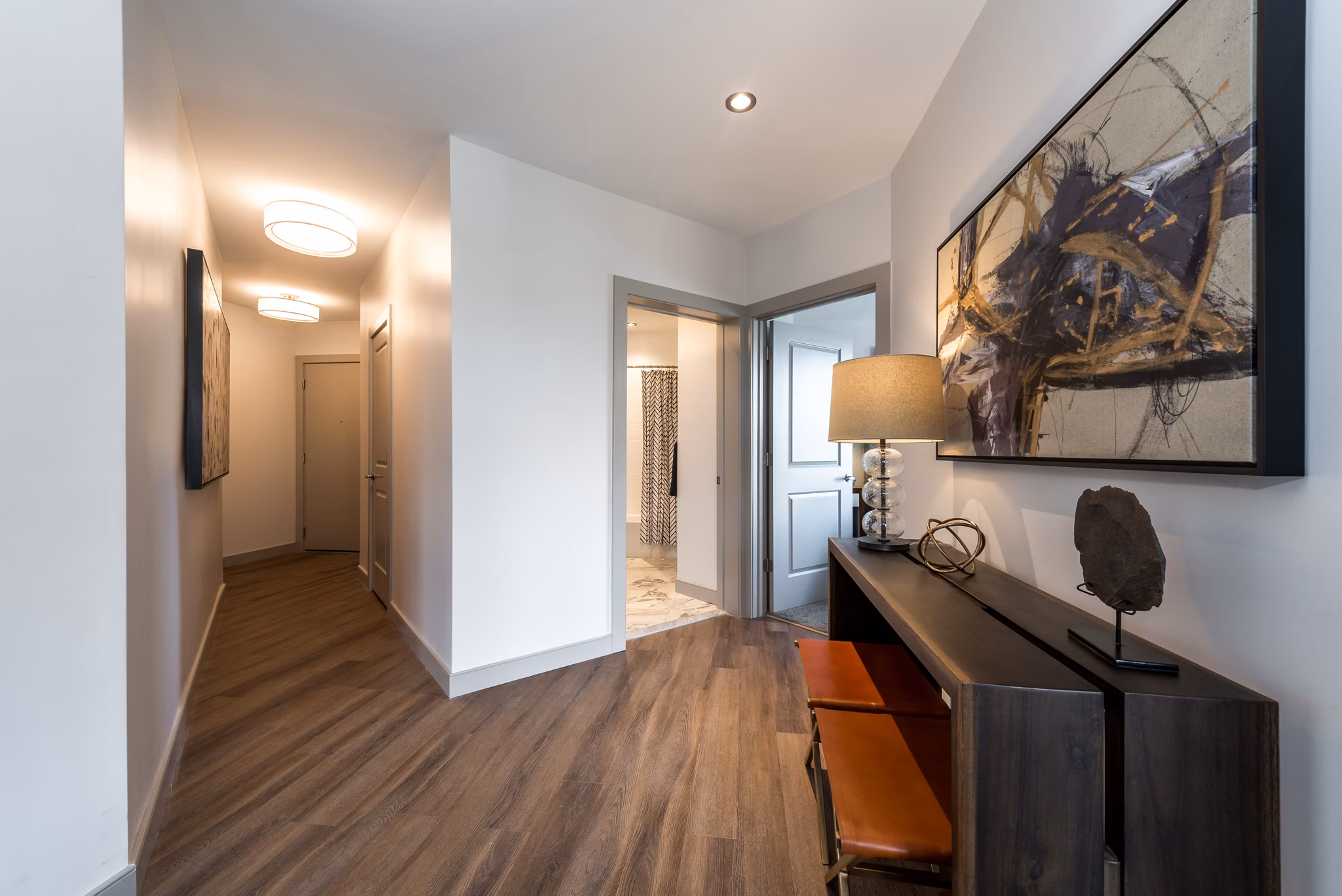 Cozy bedroom with elegant decor in Greystar luxury apartments, offering a tranquil space with modern furnishings and ample natural light