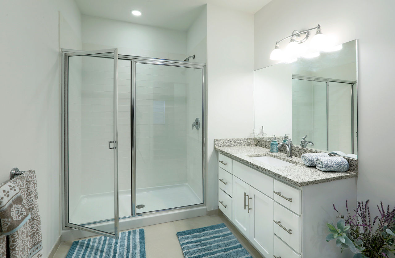 Elegant bathroom with marble countertops at The Shipyard at Port Jefferson Harbor Apartments