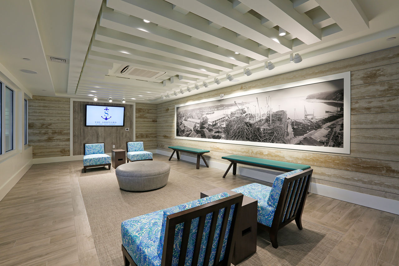 Clubhouse with modern seating and pool table at The Shipyard at Port Jefferson Harbor Apartments