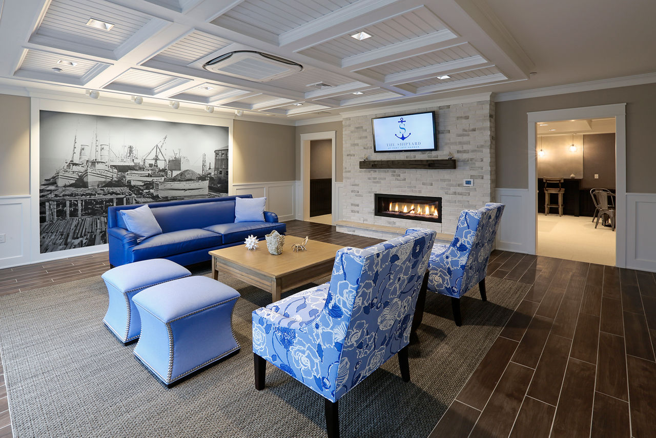 Clubhouse featuring modern design and waterfront views at The Shipyard at Port Jefferson Harbor Apartments