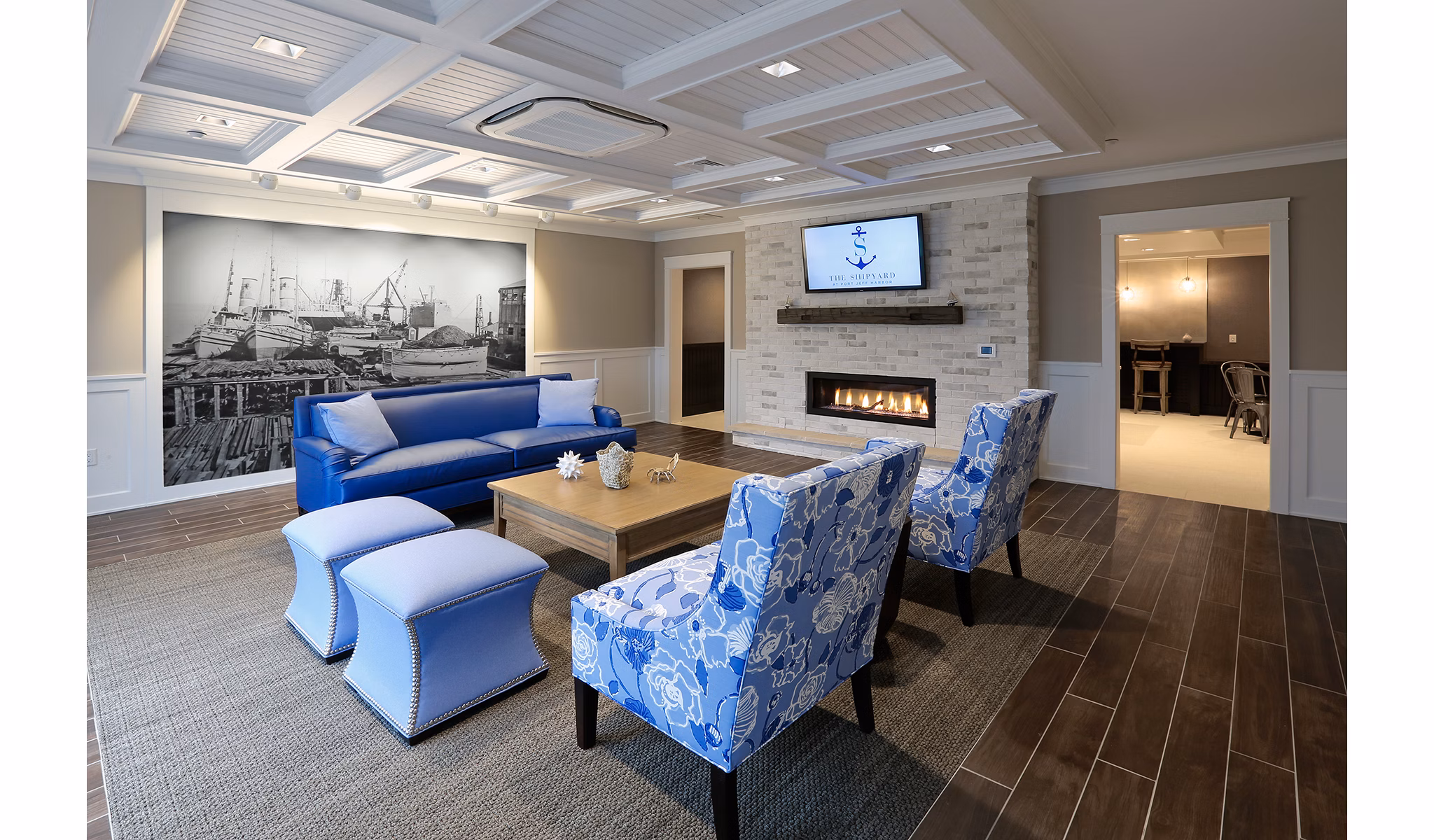 Clubhouse featuring modern design and waterfront views at The Shipyard at Port Jefferson Harbor Apartments