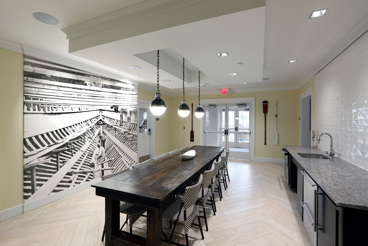 Clubhouse featuring modern decor and cozy seating at The Shipyard at Port Jefferson Harbor Apartments