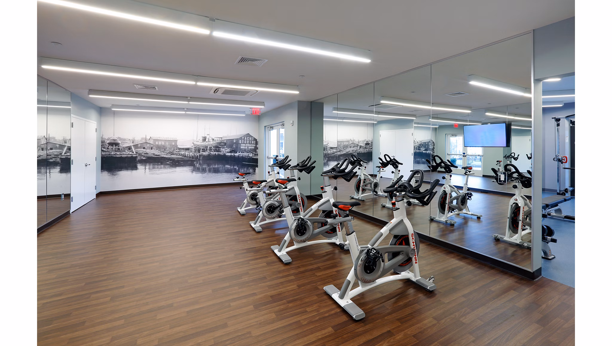 Yoga and spin studio with state-of-the-art equipment at The Shipyard at Port Jefferson Harbor Apartments, promoting wellness and fitness