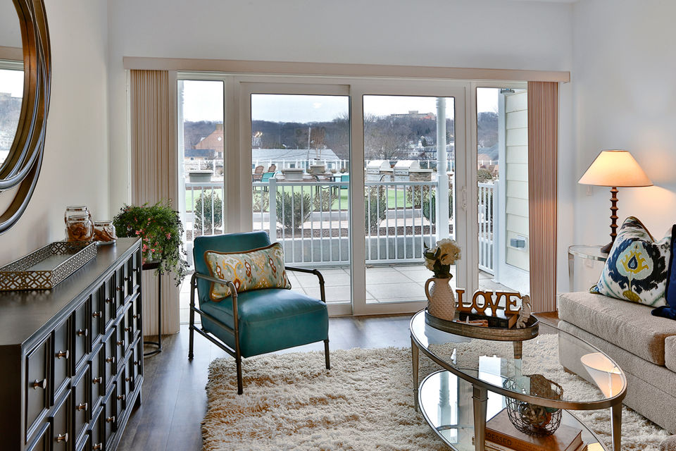 Spacious living room with modern decor in The Shipyard at Port Jefferson Harbor Apartments