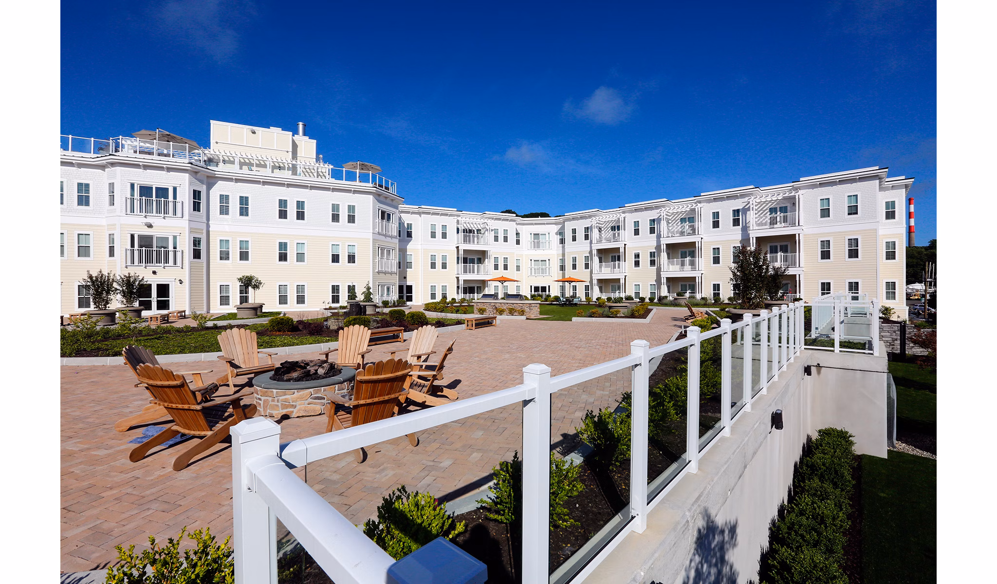 Courtyard with lush gardens at The Shipyard luxury apartments in Port Jefferson Harbor