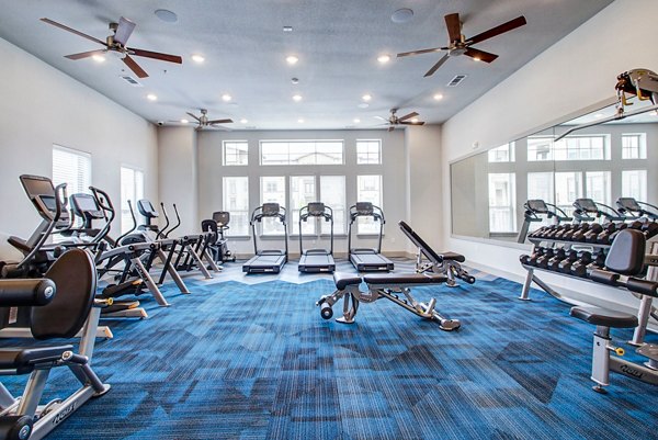 fitness center at Enclave Falcon Pointe Apartments