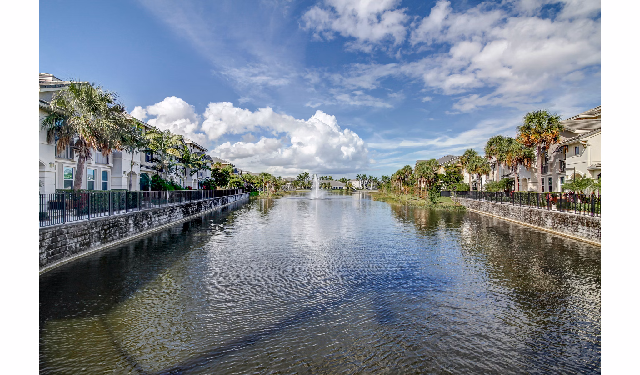The Quaye at Palm Beach Gardens: Luxury apartment exteriors in lush landscapes
