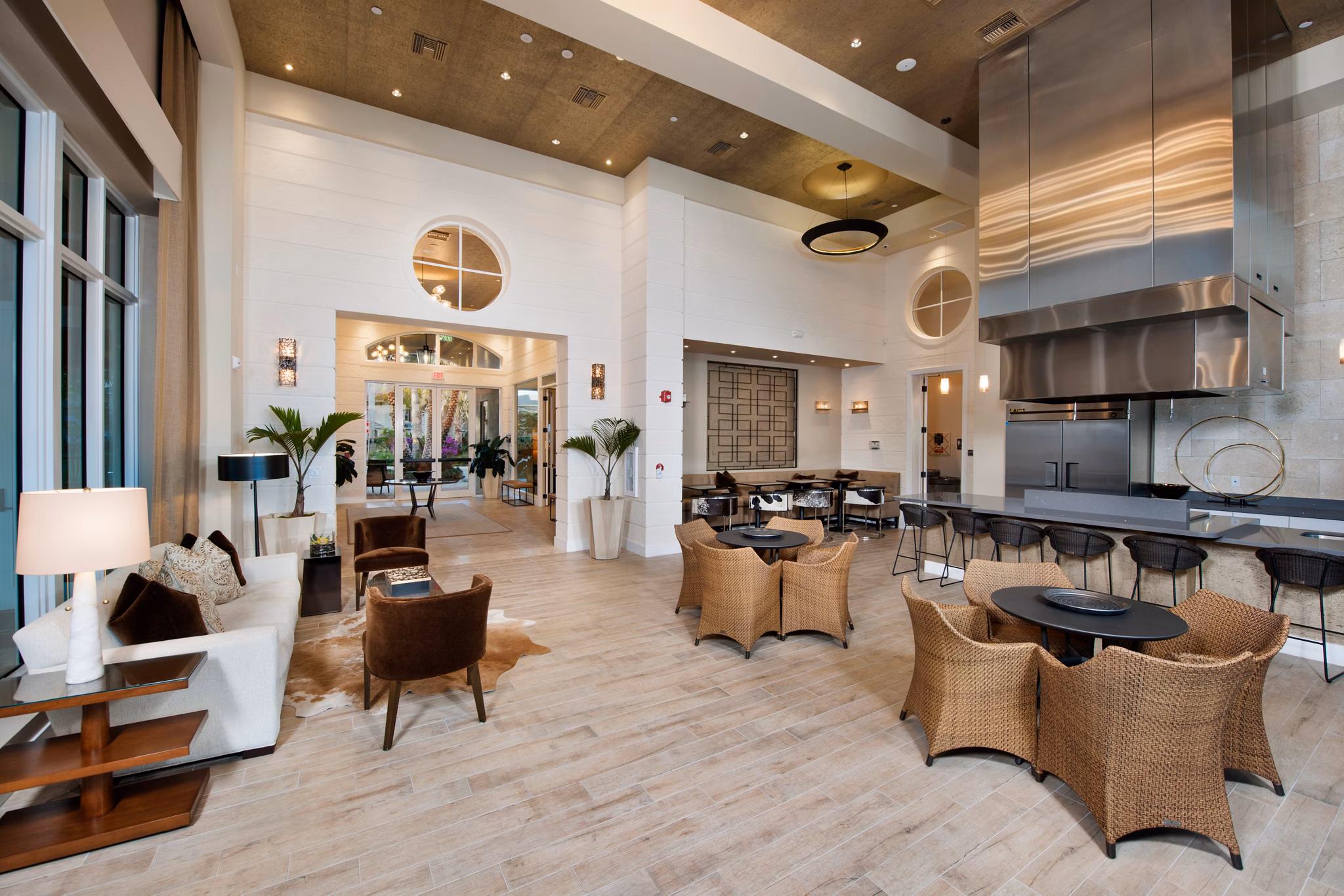 Clubhouse featuring modern design and lounge areas at The Quaye at Palm Beach Gardens Apartments