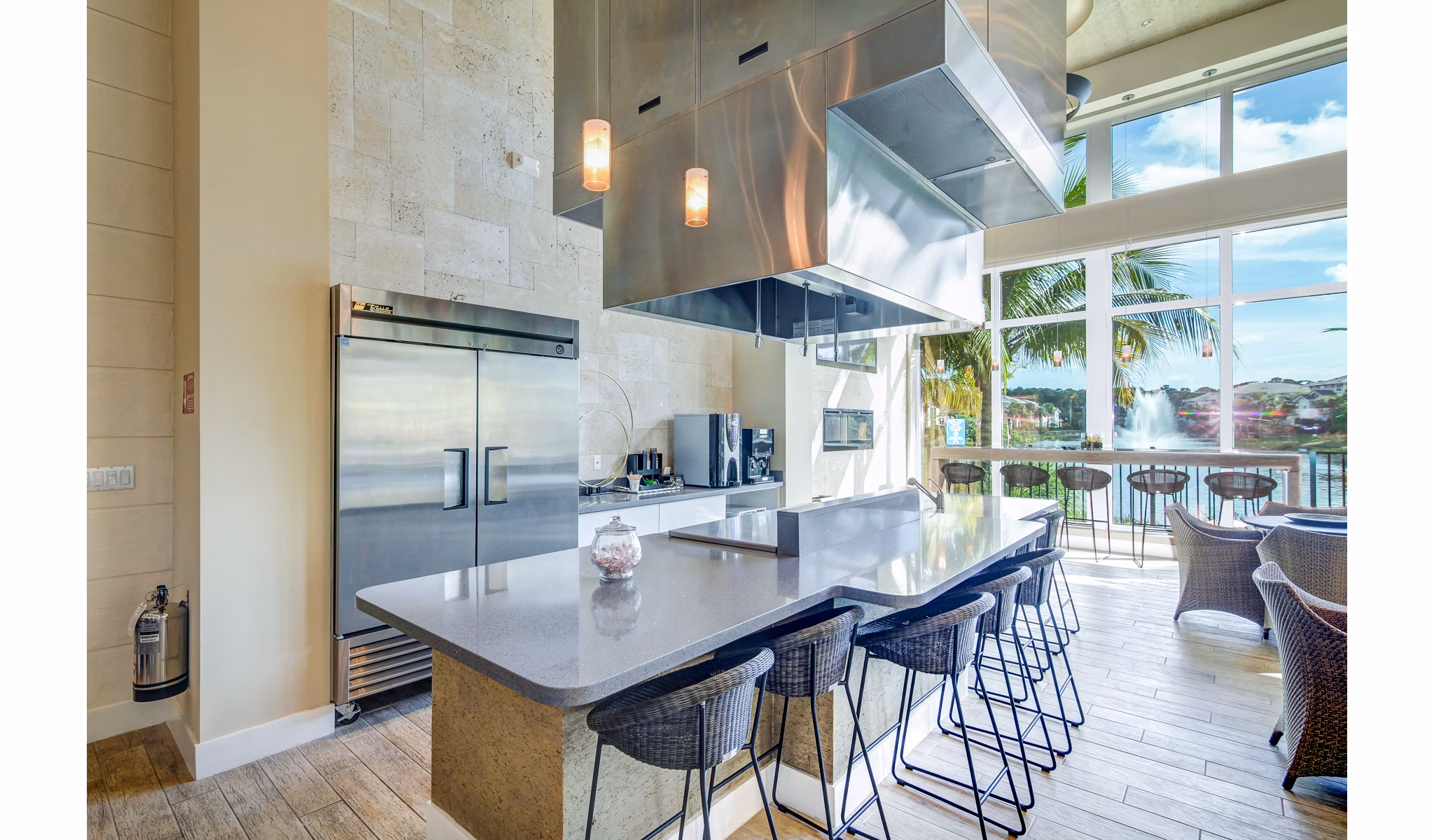 Clubhouse with modern decor and seating areas at The Quaye at Palm Beach Gardens Apartments