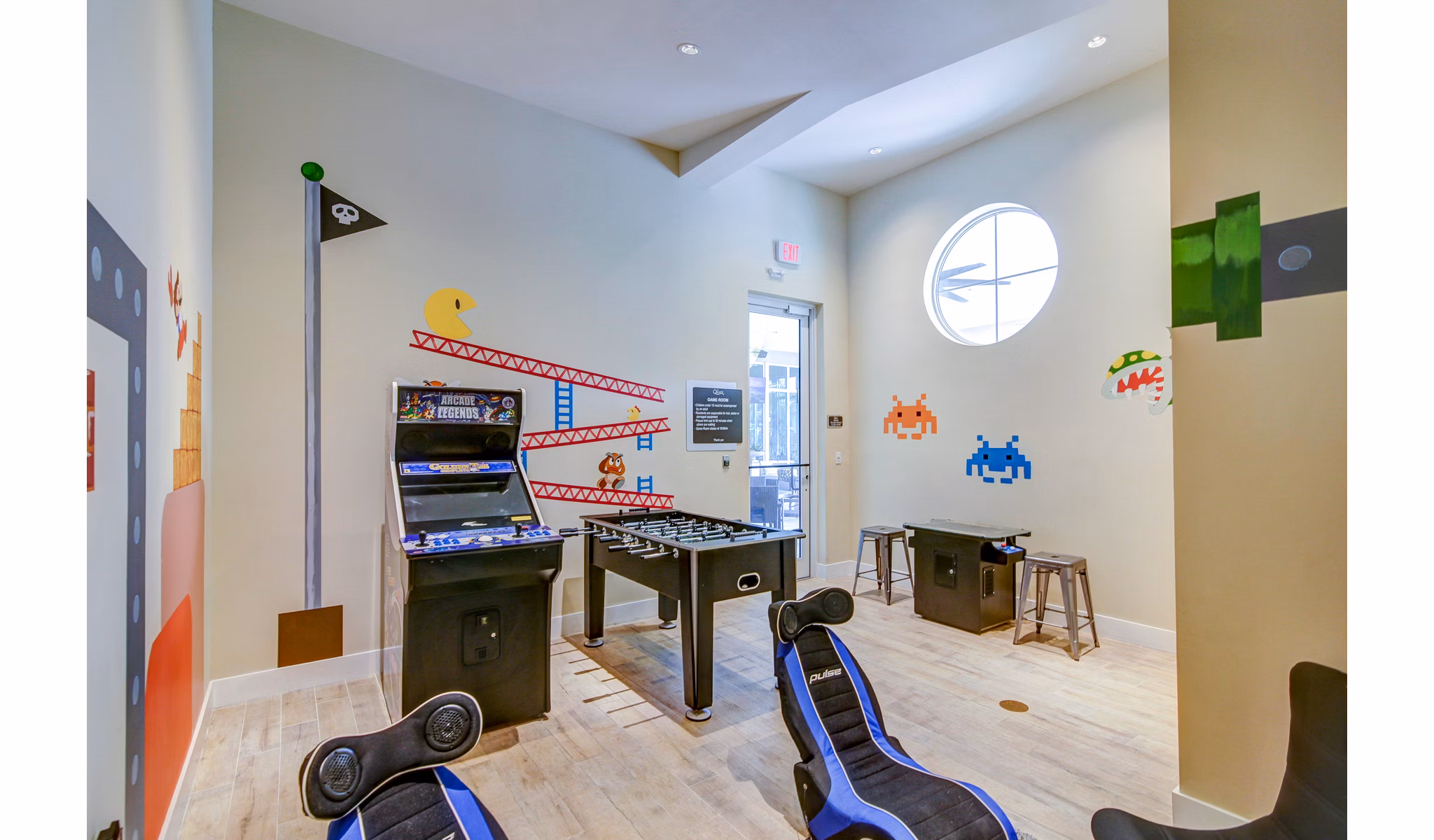 Game room with pool table at The Quaye at Palm Beach Gardens Apartments