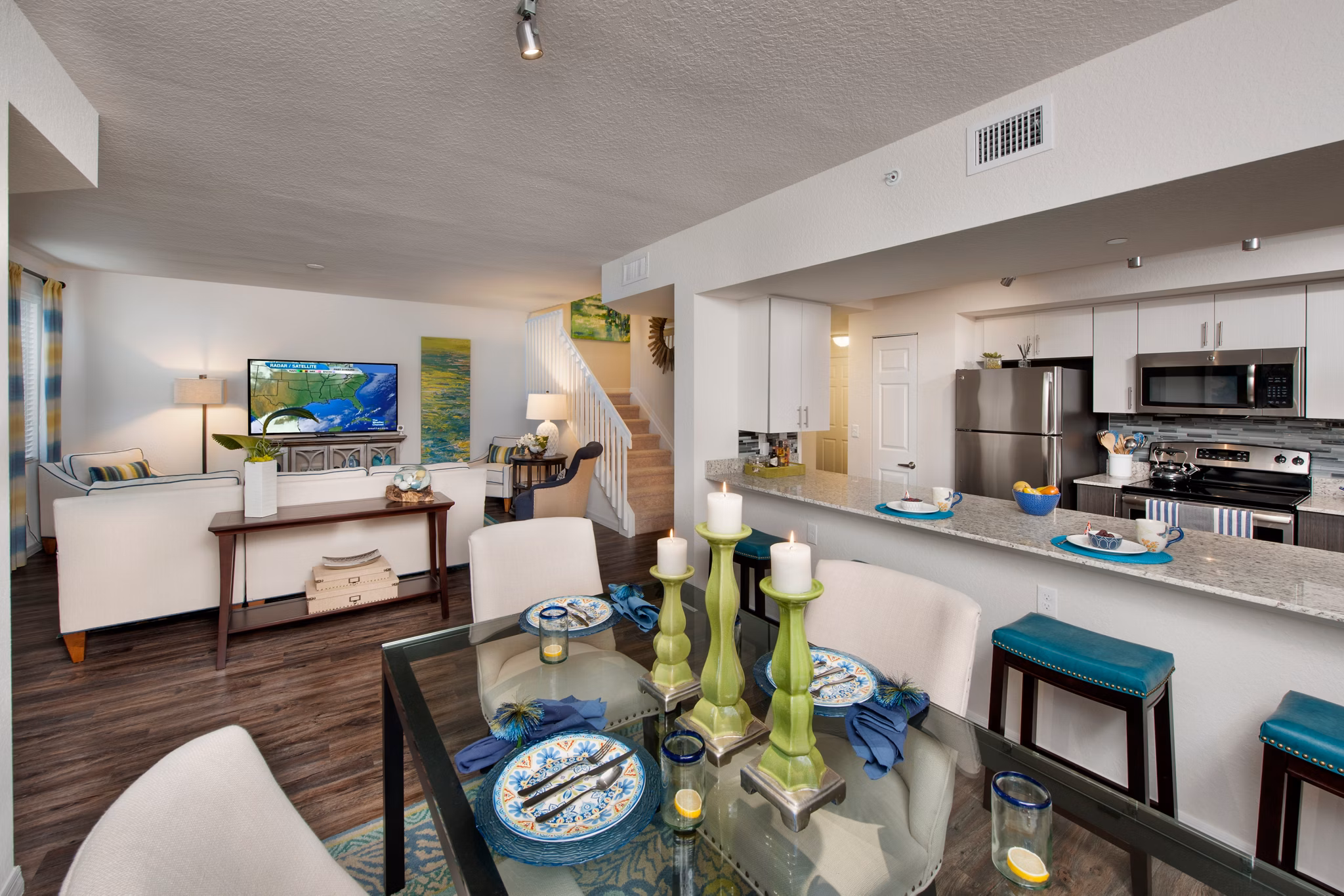Dining room with elegant decor and natural lighting at The Quaye at Palm Beach Gardens Apartments