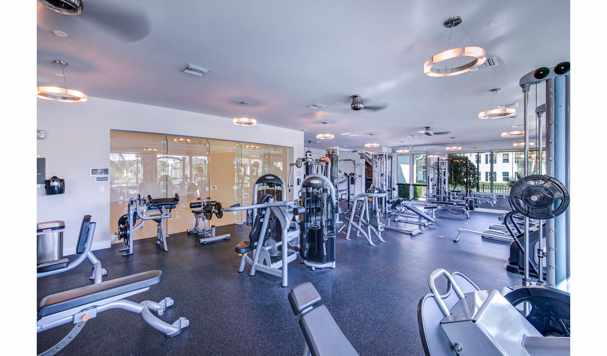 Modern fitness center with state-of-the-art equipment at The Quaye at Palm Beach Gardens Apartments