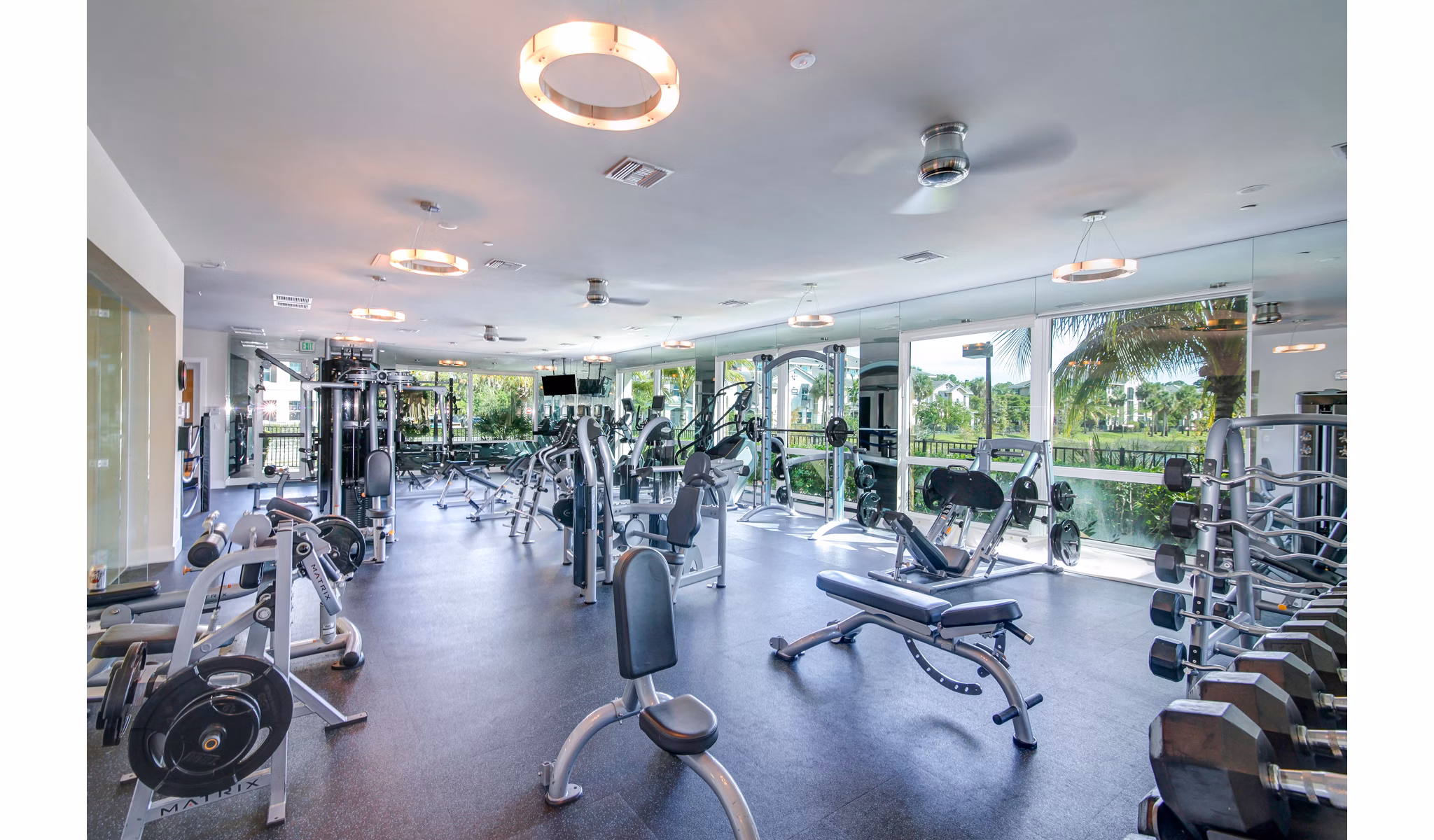 Modern fitness center with state-of-the-art equipment at The Quaye at Palm Beach Gardens Apartments