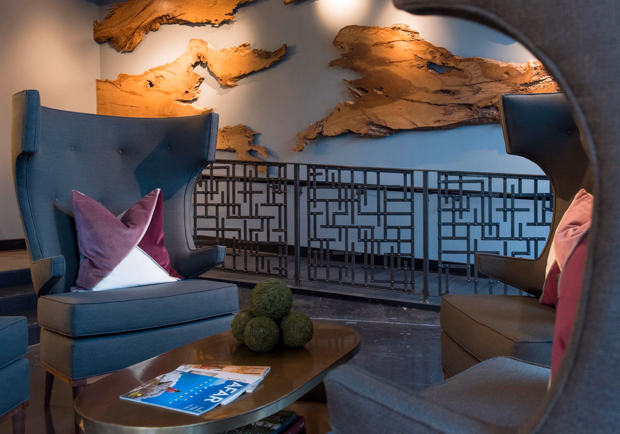 Elegant clubhouse featuring pool table and plush seating at The Guild luxury apartments