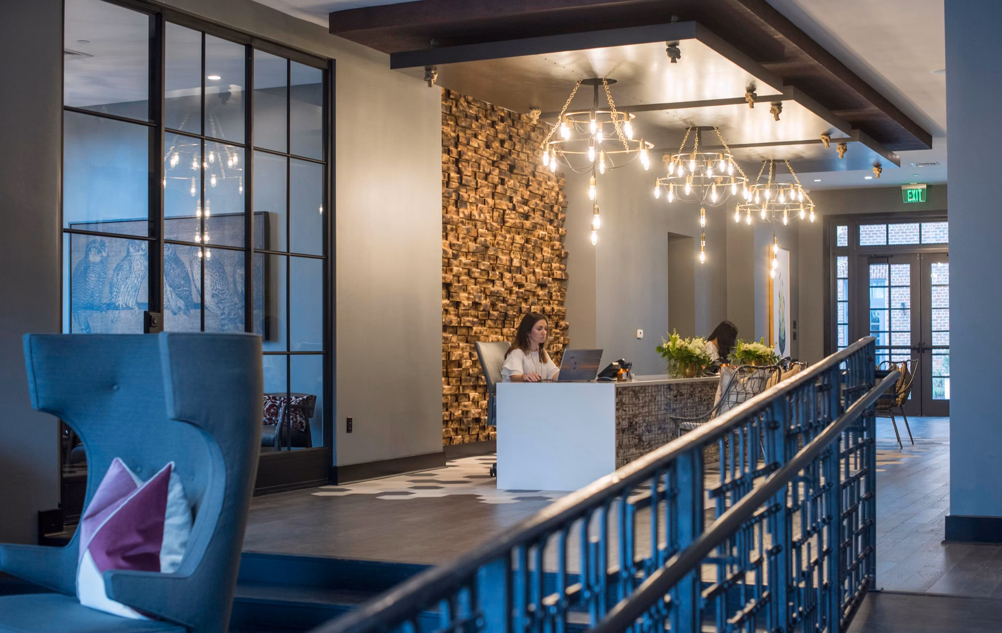 Expansive clubhouse with modern furnishings at The Guild Apartments, offering luxury living in an exclusive community