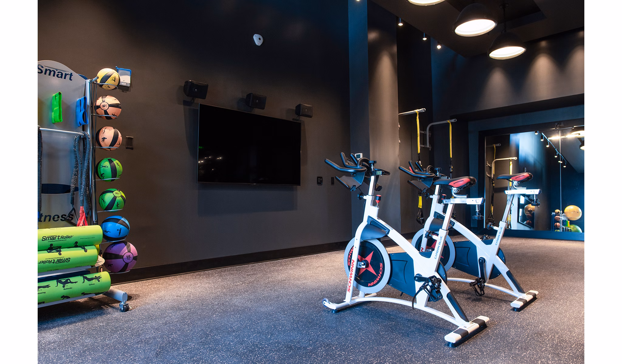 State-of-the-art fitness center with modern equipment at The Guild Apartments, offering luxury workout spaces for residents