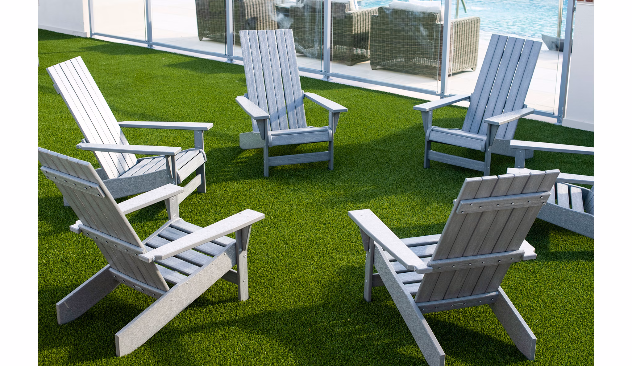 Chic patio/balcony area with cozy seating at The Guild Apartments, perfect for relaxation in this luxury living community