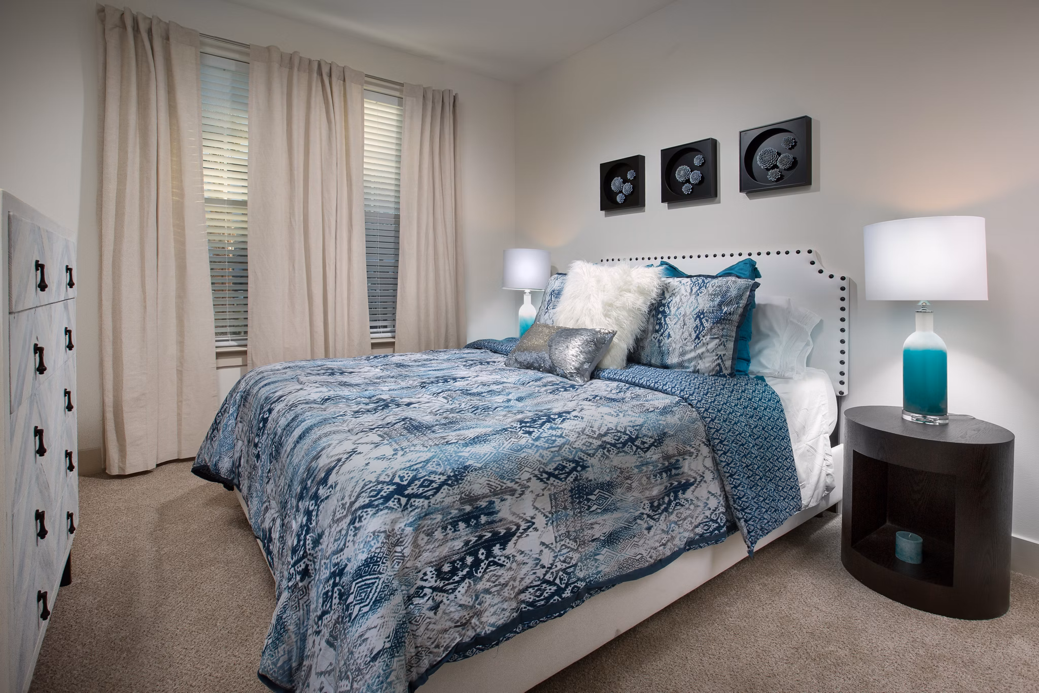 Cozy bedroom with ocean-inspired decor at Sea Glass Apartments