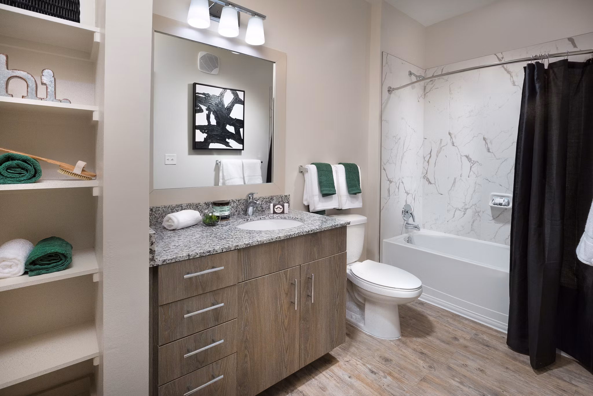 Bathroom featuring elegant fixtures and marble countertops in Sea Glass Apartments