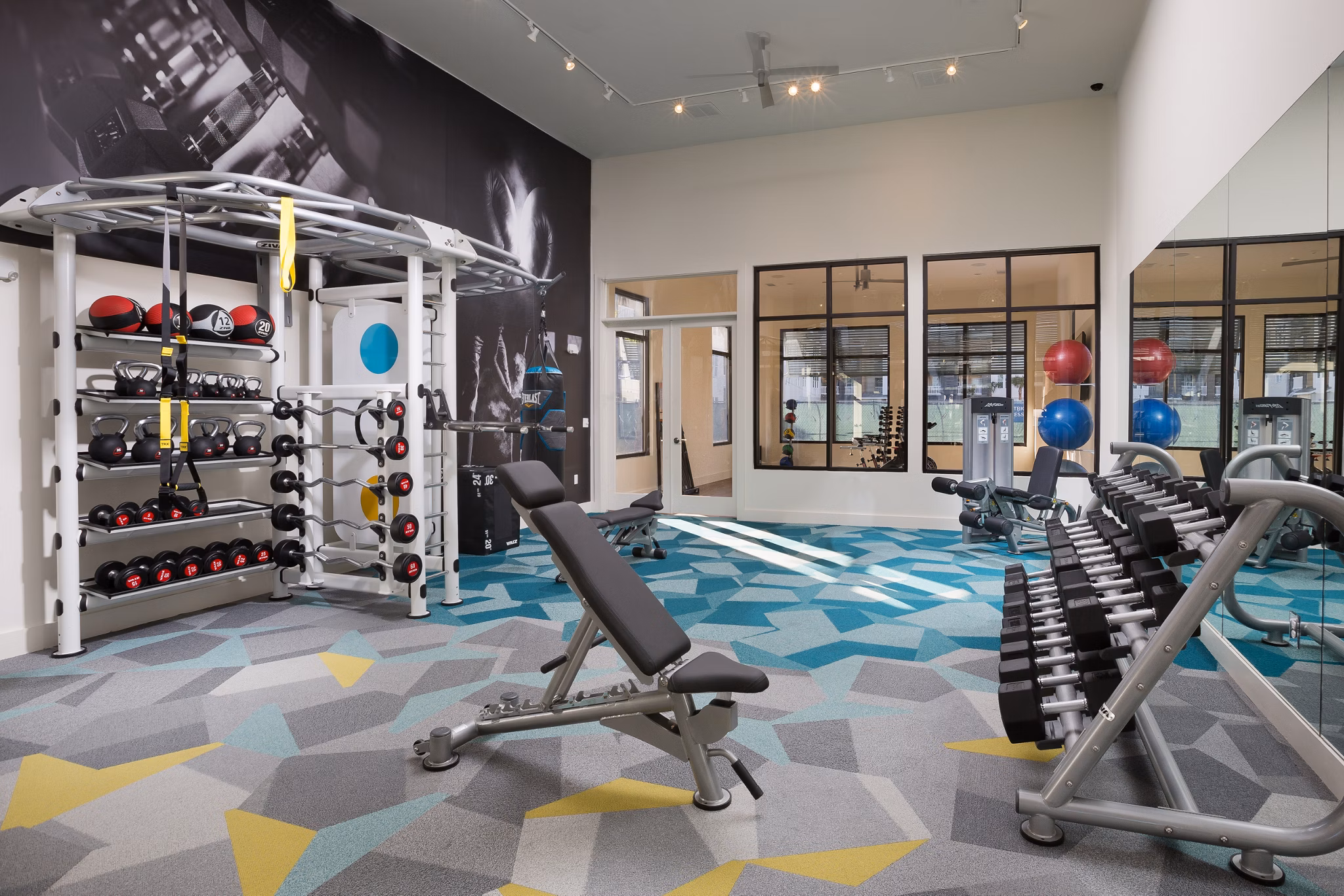 State-of-the-art fitness center with modern equipment at Sea Glass Apartments luxury community